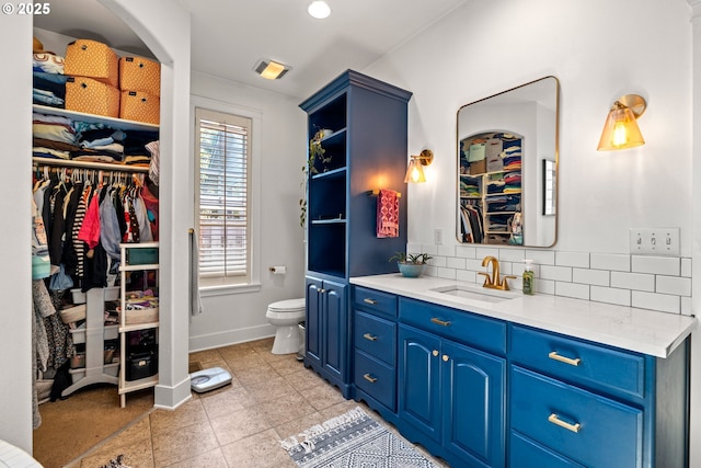 9628 N Exeter Ave, Portland, OR 97203 - bathroom featuring vanity, backsplash, and a spacious closet