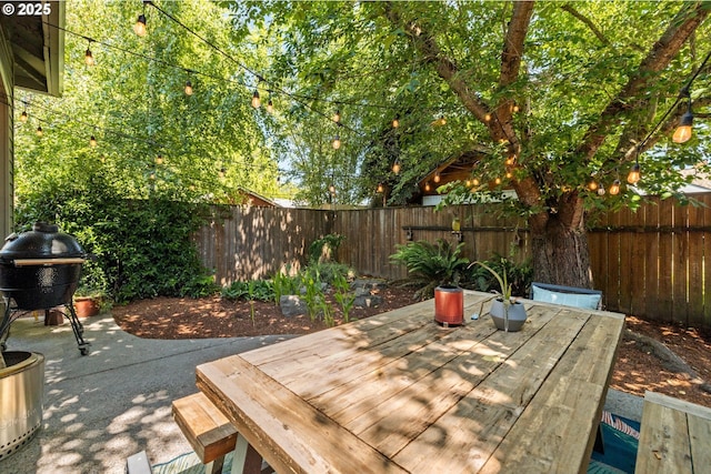 9628 N Exeter Ave, Portland, OR 97203 - fenced backyard with a patio area and area for grilling