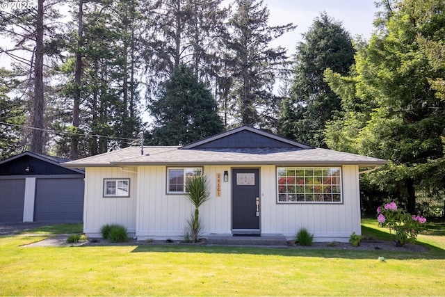 29311 Joy Ln, Ocean Park, WA 98640 - ranch-style home featuring a garage, a front lawn, an outdoor structure, and a shingled roof