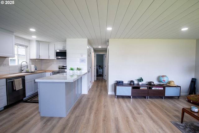 29311 Joy Ln, Ocean Park, WA 98640 - kitchen with appliances with stainless steel finishes, a sink, wooden counters, light wood-style floors, and wooden ceiling