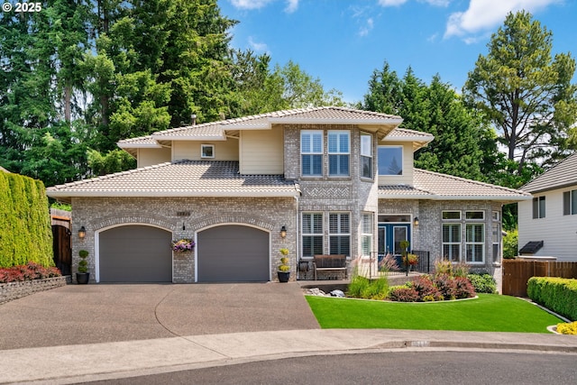 10440 SW 141st Ave, Beaverton, OR 97008 - view of front of house featuring a tiled roof, brick siding, and driveway