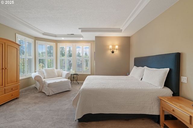 10440 SW 141st Ave, Beaverton, OR 97008 - bedroom with a tray ceiling, light carpet, and a textured ceiling