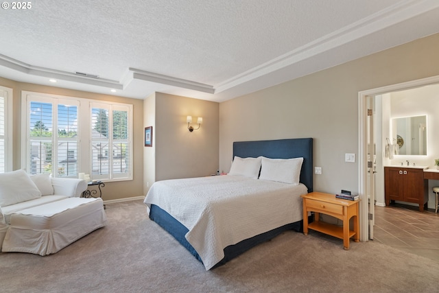 10440 SW 141st Ave, Beaverton, OR 97008 - bedroom featuring a textured ceiling, light carpet, a raised ceiling, and ensuite bathroom
