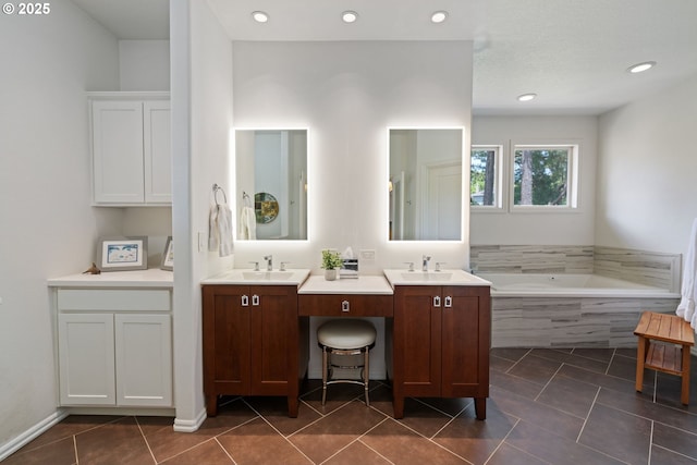 10440 SW 141st Ave, Beaverton, OR 97008 - bathroom with double vanity, a garden tub, tile patterned flooring, and recessed lighting