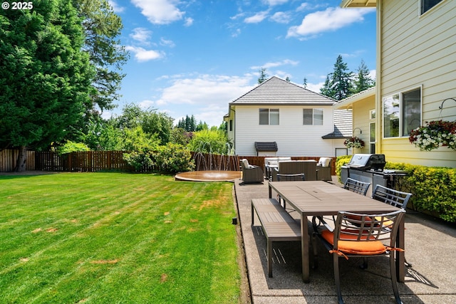 10440 SW 141st Ave, Beaverton, OR 97008 - fenced backyard with a patio area, outdoor dining area, and an outdoor hangout area