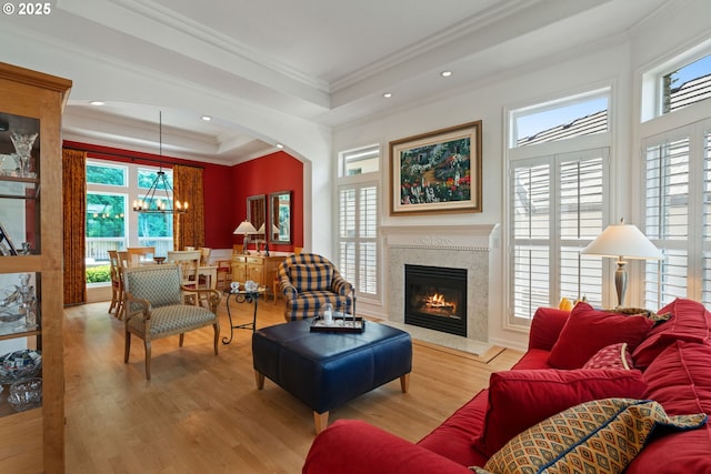 10440 SW 141st Ave, Beaverton, OR 97008 - living area featuring crown molding, a tray ceiling, healthy amount of natural light, a chandelier, and recessed lighting