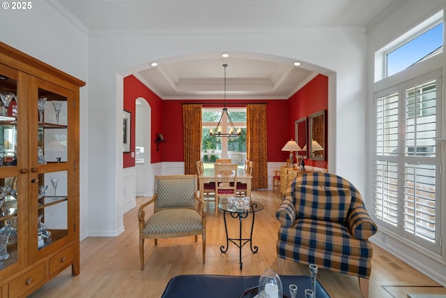 10440 SW 141st Ave, Beaverton, OR 97008 - living area with plenty of natural light, arched walkways, a chandelier, wood finished floors, and wainscoting