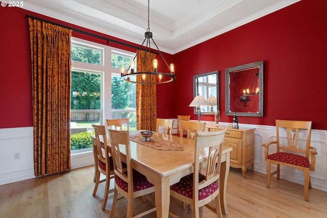 10440 SW 141st Ave, Beaverton, OR 97008 - dining space with light wood-type flooring, healthy amount of natural light, a chandelier, ornamental molding, and a wainscoted wall