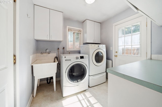 1510 SE 143rd Ave, Portland, OR 97233 - washroom with cabinet space, washing machine and dryer, and plenty of natural light