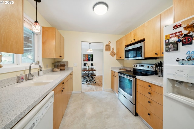1510 SE 143rd Ave, Portland, OR 97233 - kitchen with stainless steel appliances, light brown cabinetry, light floors, and light countertops