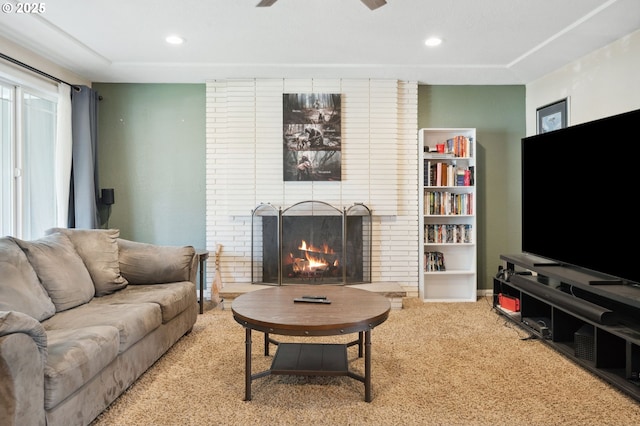 1510 SE 143rd Ave, Portland, OR 97233 - carpeted living room featuring ceiling fan, a brick fireplace, and recessed lighting