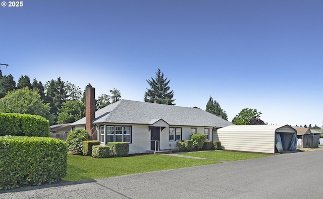 210 Holeman Ave, Eugene, OR 97404 - view of front of home with a front yard, a chimney, and a shingled roof
