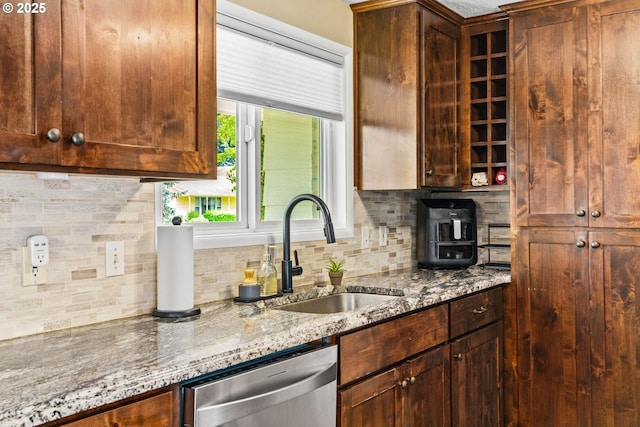 1561 Balboa St, Eugene, OR 97408 - kitchen featuring stainless steel dishwasher, decorative backsplash, and light stone countertops