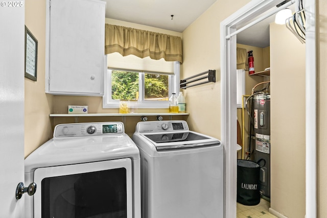 1561 Balboa St, Eugene, OR 97408 - laundry area featuring independent washer and dryer, electric water heater, and cabinet space