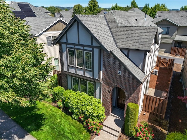6638 NW Joss Ave, Portland, OR 97229 - tudor home with a shingled roof, brick siding, and stucco siding