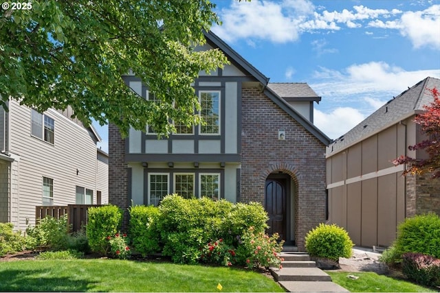 6638 NW Joss Ave, Portland, OR 97229 - tudor-style house featuring brick siding, stucco siding, and a front lawn
