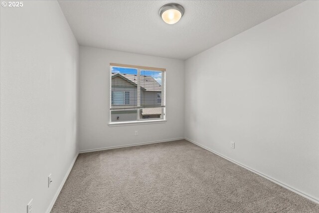 6638 NW Joss Ave, Portland, OR 97229 - carpeted spare room featuring baseboards and a textured ceiling