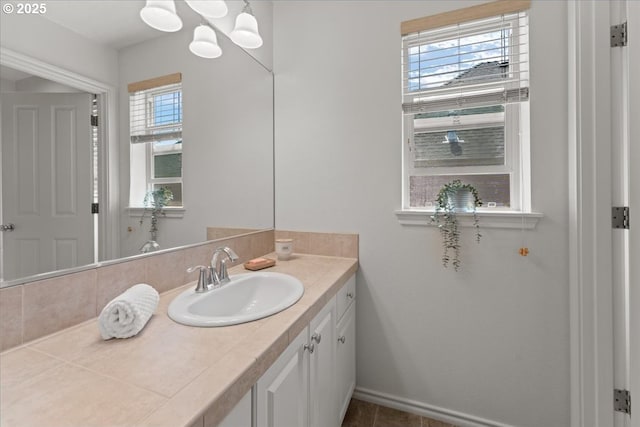 6638 NW Joss Ave, Portland, OR 97229 - bathroom featuring vanity, a chandelier, and baseboards