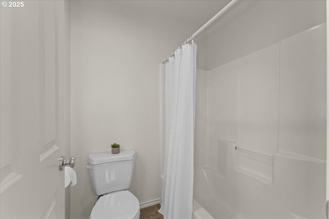 6638 NW Joss Ave, Portland, OR 97229 - full bathroom with toilet, shower / bathtub combination with curtain, and baseboards