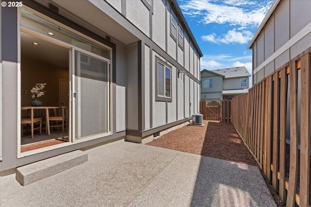 6638 NW Joss Ave, Portland, OR 97229 - view of patio with a gate and central AC unit