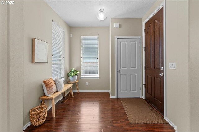 6638 NW Joss Ave, Portland, OR 97229 - foyer with dark wood-type flooring and baseboards