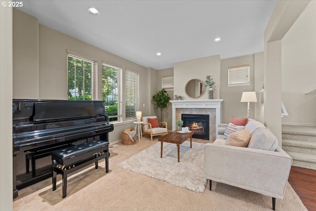 6638 NW Joss Ave, Portland, OR 97229 - living area featuring a tiled fireplace, recessed lighting, stairs, and baseboards