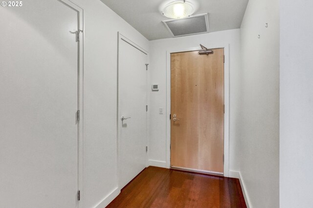 3601 S River Pkwy Unit 1118, Portland, OR 97239 - doorway to outside featuring dark wood finished floors and baseboards