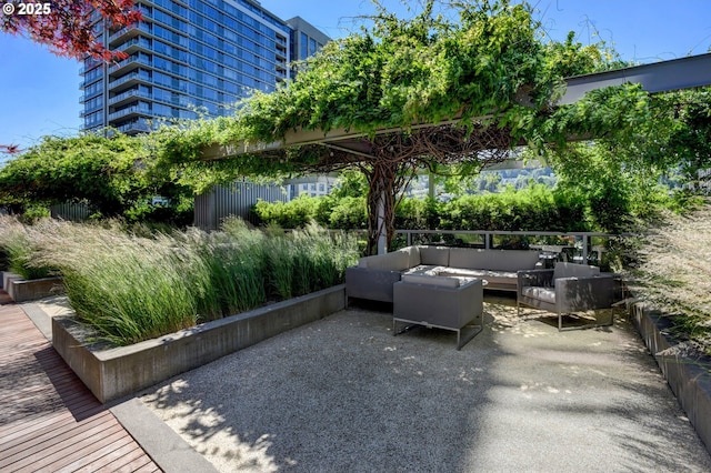 view of patio with outdoor lounge area and fence