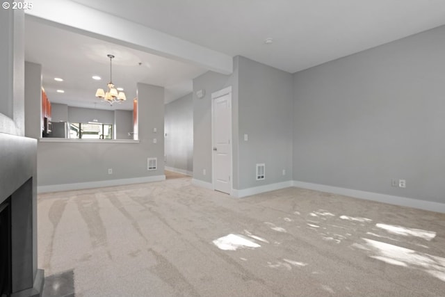 1919 NE 50th Way, Hillsboro, OR 97124 - unfurnished living room with a chandelier, light colored carpet, baseboards, and recessed lighting