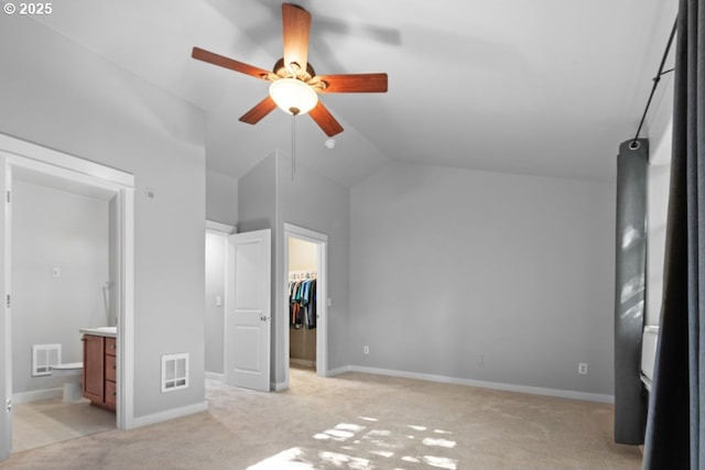 1919 NE 50th Way, Hillsboro, OR 97124 - unfurnished bedroom with a walk in closet, light carpet, lofted ceiling, a closet, and baseboards