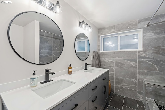 bathroom featuring vanity and a shower