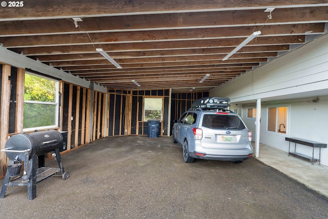 view of vehicle parking featuring a carport