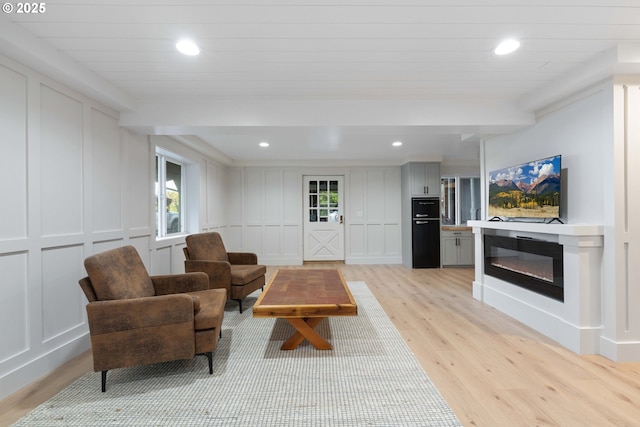 living room with light hardwood / wood-style flooring