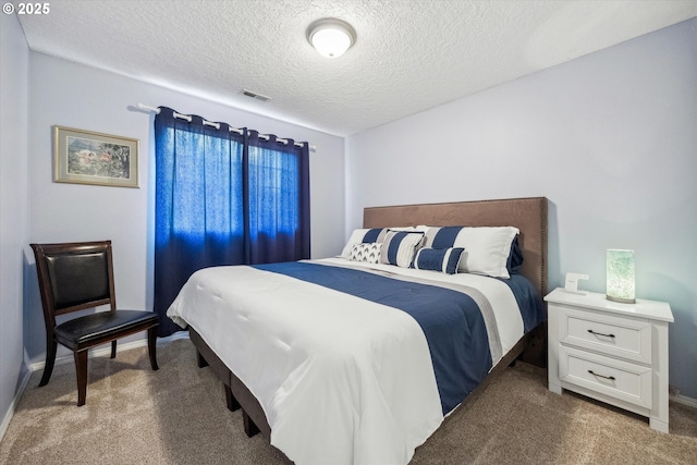 19580 SW 56th Ct, Tualatin, OR 97062 - bedroom featuring light carpet, a textured ceiling, and baseboards