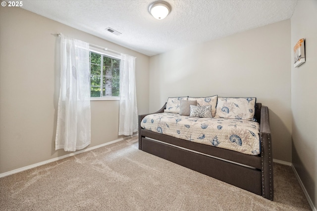 19580 SW 56th Ct, Tualatin, OR 97062 - carpeted bedroom with a textured ceiling and baseboards