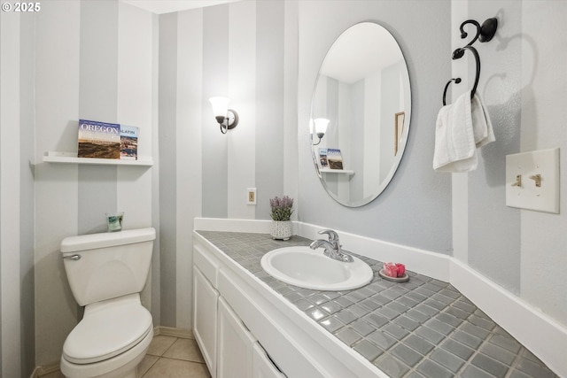 19580 SW 56th Ct, Tualatin, OR 97062 - half bathroom featuring vanity, toilet, and tile patterned floors