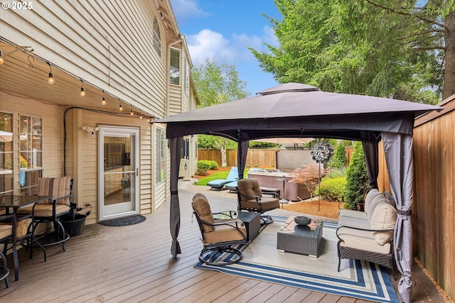 19580 SW 56th Ct, Tualatin, OR 97062 - wooden deck featuring a hot tub, a gazebo, and a fenced backyard
