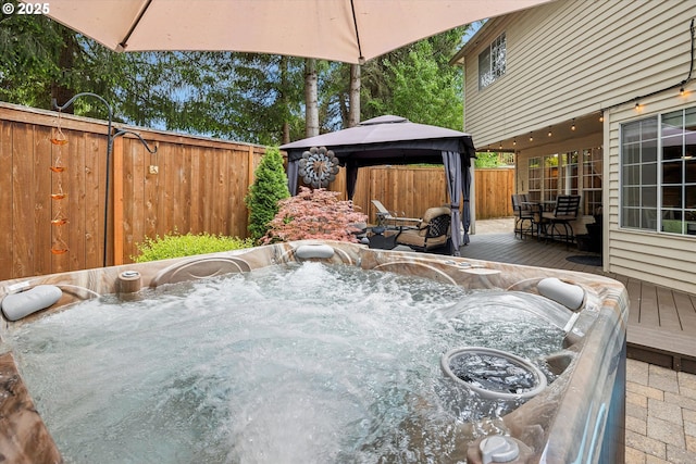 19580 SW 56th Ct, Tualatin, OR 97062 - wooden terrace featuring a hot tub, a gazebo, and a fenced backyard