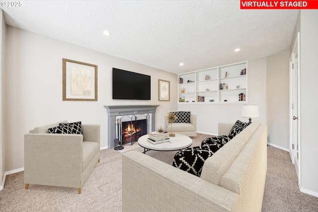 19580 SW 56th Ct, Tualatin, OR 97062 - carpeted living area with a warm lit fireplace, recessed lighting, a textured ceiling, and baseboards