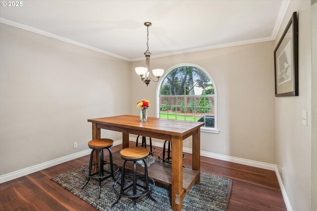 19580 SW 56th Ct, Tualatin, OR 97062 - dining room featuring dark wood finished floors, ornamental molding, baseboards, and a chandelier