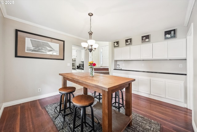19580 SW 56th Ct, Tualatin, OR 97062 - dining room featuring dark wood-style floors, ornamental molding, baseboards, and a chandelier