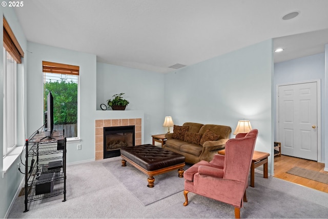 23804 SW Golden Pond Ter, Sherwood, OR 97140 - carpeted living area with a fireplace, baseboards, and recessed lighting