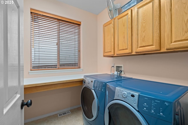 23804 SW Golden Pond Ter, Sherwood, OR 97140 - laundry area featuring cabinet space, washing machine and dryer, and baseboards
