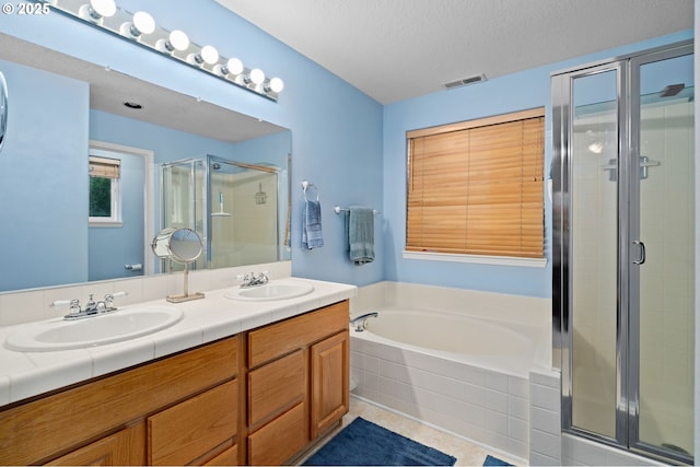 23804 SW Golden Pond Ter, Sherwood, OR 97140 - full bath with a shower stall, double vanity, a garden tub, tile patterned flooring, and a textured ceiling