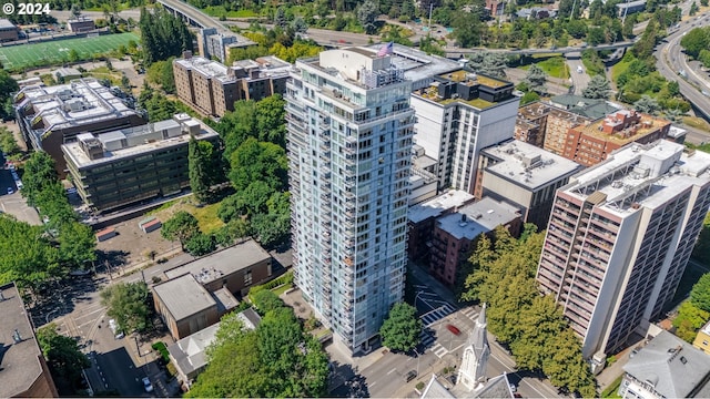 birds eye view of property with a view of city