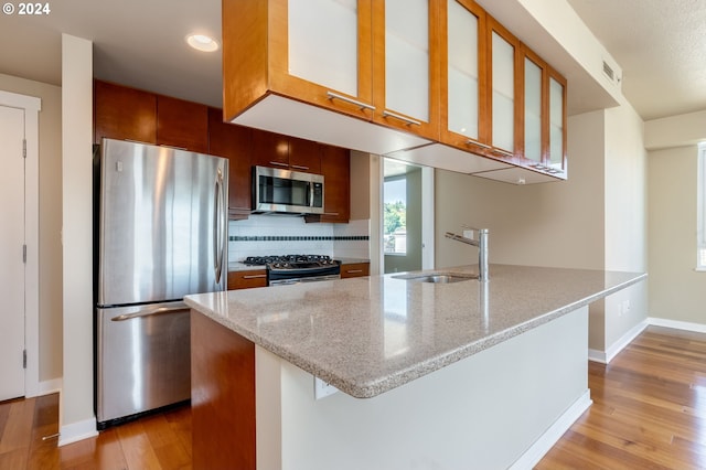 1500 SW 11th Ave Unit 1703, Portland, OR 97201 - kitchen featuring visible vents, stainless steel appliances, light wood-style floors, and a sink