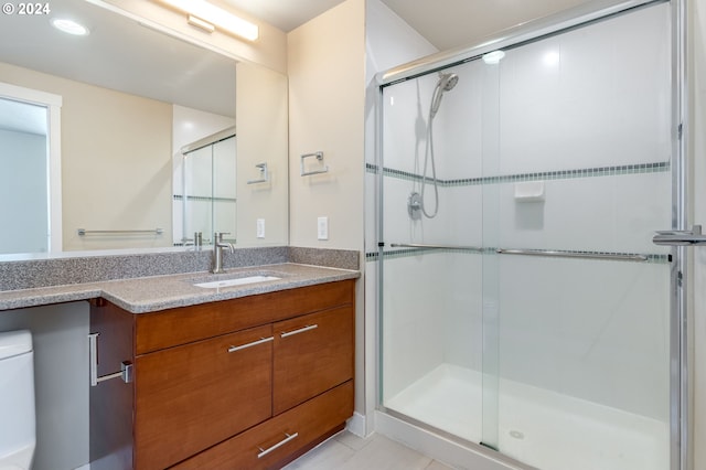 1500 SW 11th Ave Unit 1703, Portland, OR 97201 - bathroom featuring vanity, a shower stall, and toilet
