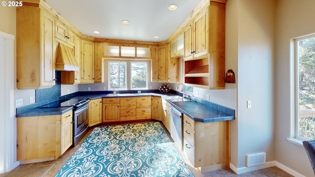 kitchen featuring visible vents, light brown cabinets, tile countertops, stainless steel electric range oven, and dishwashing machine