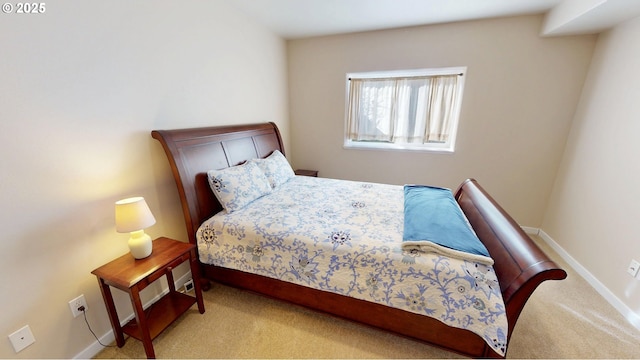 carpeted bedroom with baseboards