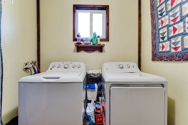 laundry area with washing machine and clothes dryer